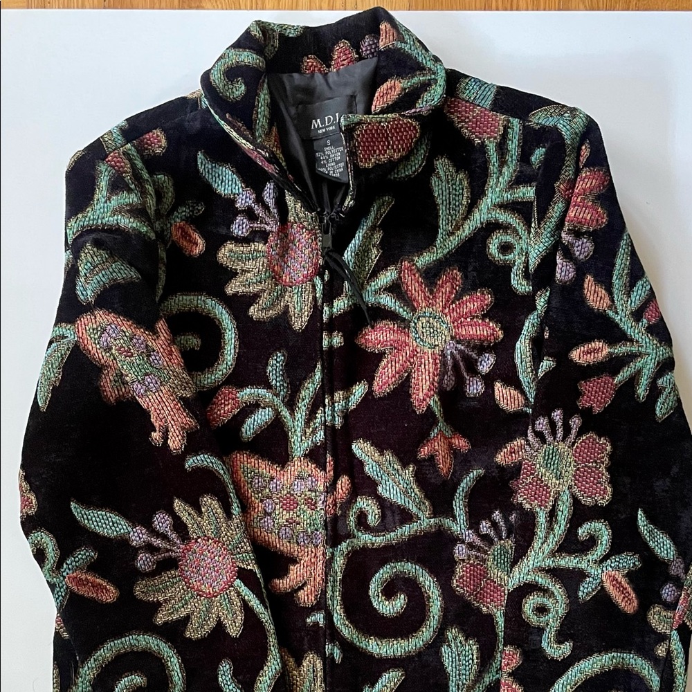 M.D.L. New York Polyester, Rayon and Cotton Jacket with zipper in front.